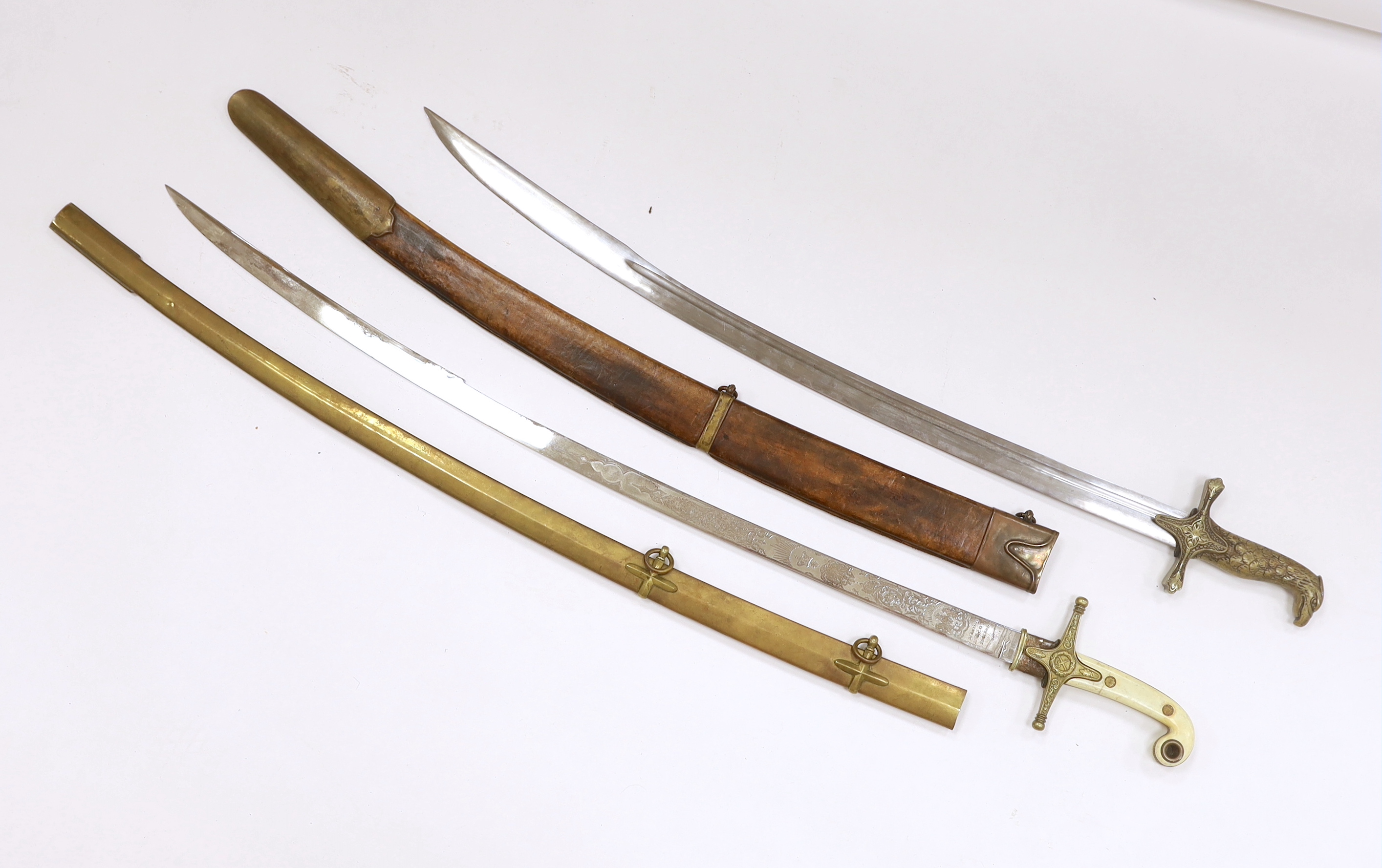 Two reproduction swords; a Victorian style naval design Mameluke sword, together with an Indian style sword, longest blade 84cm